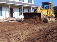 bull dozer in front yard