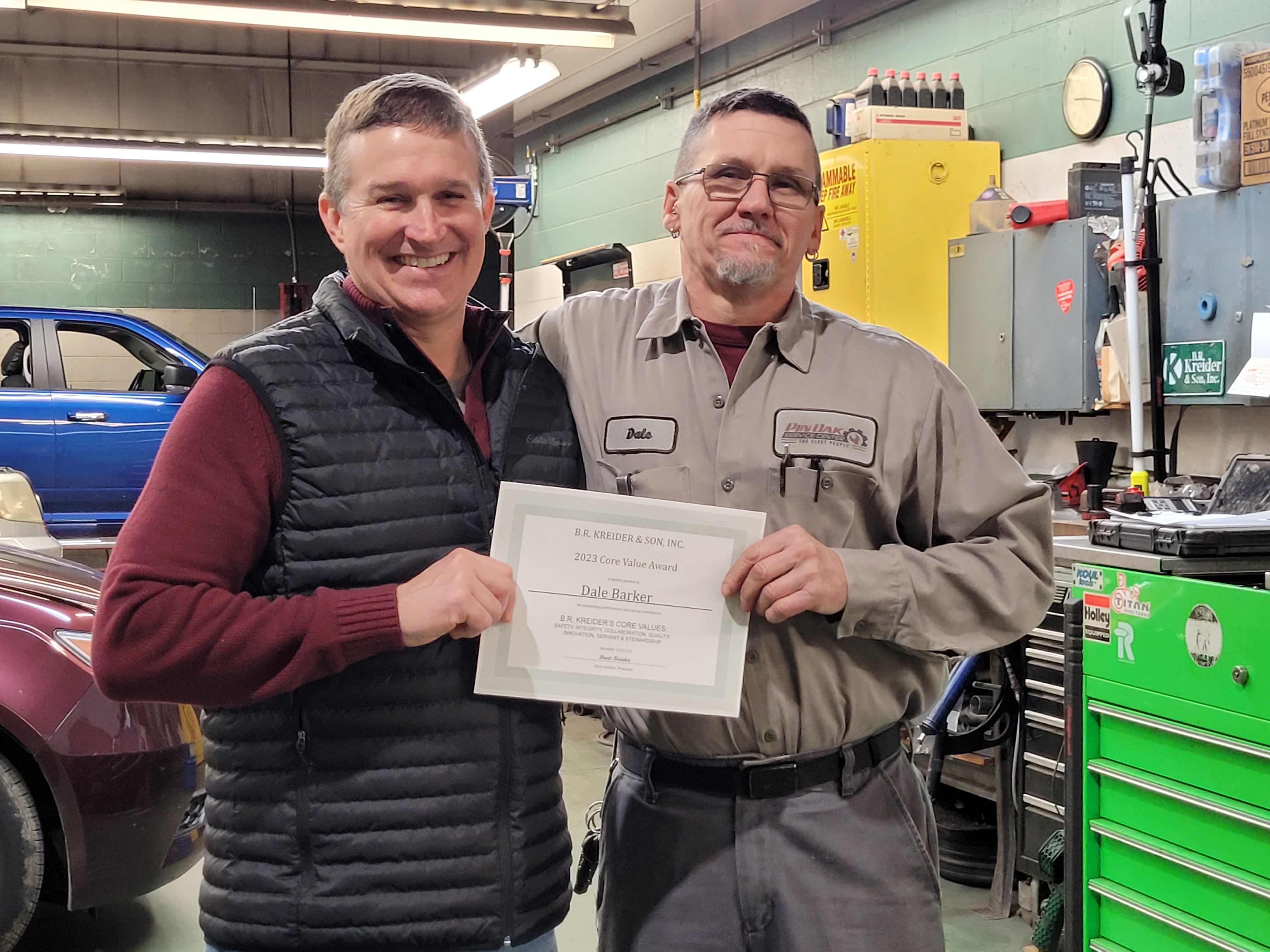 Dale Barker, Lead Technician of Pin Oak Service Center, with the 2023 B.R. Kreider Core Value Award Presented by Brent Kreider